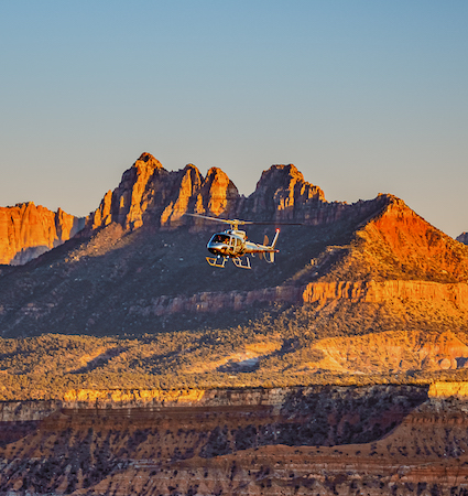 Our 35 mile Zion National Park helicopter flight ventures north between Smith Mesa on your way to seeing the dark red rock figures of Kolob Canyons after circling Red Butte Mountain!